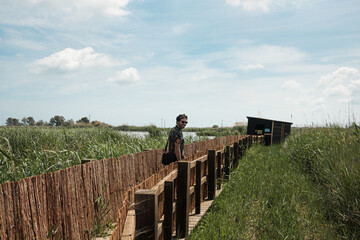 Man walking to a bird observatory