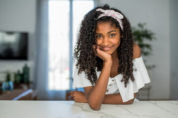 Portrait of a beautiful young black teenage girl looking into camera