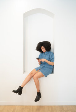 Afro Woman Using Cellphone