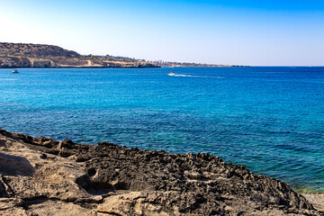 View of the blue lagoon. A popular place in the Cape Greco National Forest Park on the island of Cyprus. Mediterranean landscape.