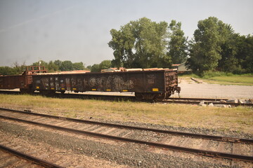 Fototapeta na wymiar Train Car on Railroad Tracks
