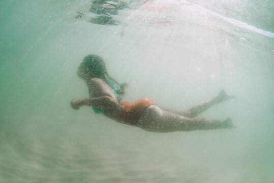 Girl swims in cloudy water