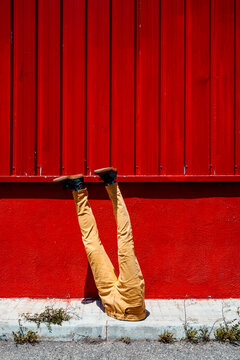 mannequin man upside-down in an industrial park