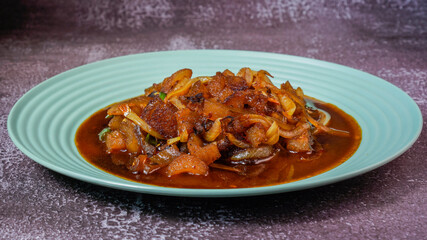 Stir fry cow skin with spicy soy sauce.