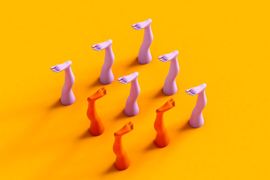 Colorful human legs on yellow background