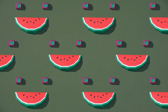 seamless pattern with handmade cardboard berries and watermelon slices isolated on green
