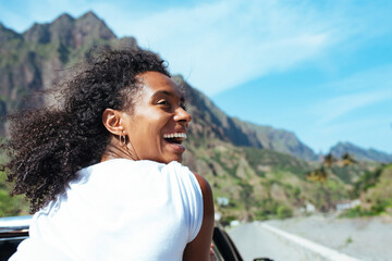 Carefree African woman in pickup
