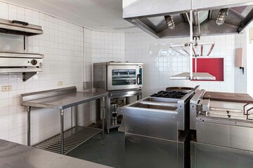 Empty stainless steel kitchen with no people inside the large kitchen