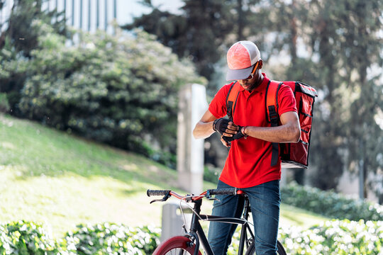 Delivery Man Fastening His Gloves