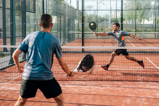 Men playing padel