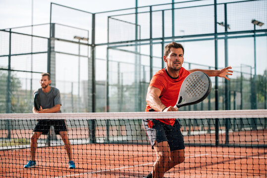 Men playing padel