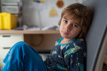 Portrait of a six year old boy looking at camera