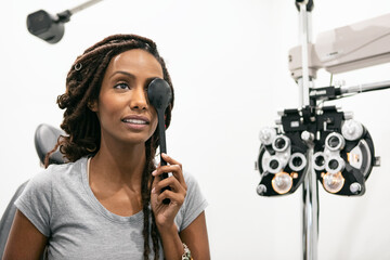 Eyewear: Woman Uses Eye Occluder During Exam