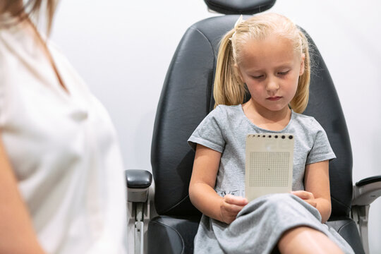 Eyewear: Chilld Reads Eye Chart During Exam
