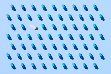 Seamless pattern with blue pills on blue background.