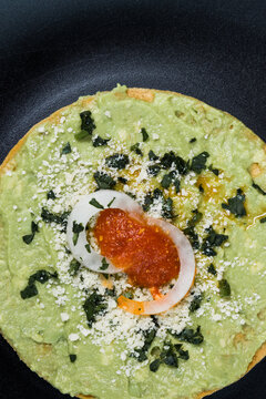 close up of a typical tostada cover with guacamole from Guatemala