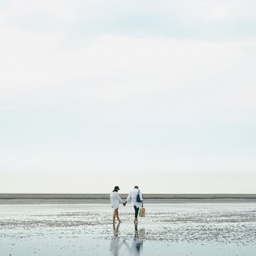 Couple Holding Hand Walk On The Beach