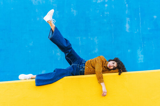 trendy young woman posing on street