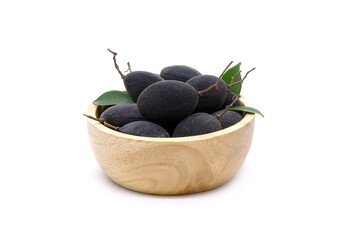 Velvet tamarind in wooden bowl isolated on white background. Black Velvet Tamarind (Dialium cochinchinense)
