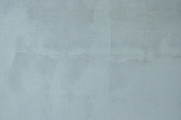 applying a primer coat before painting wall background.