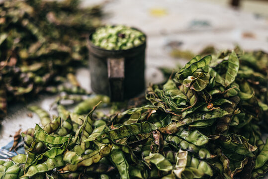Shelled green beans in a mug on table