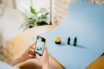 Beauty blogger taking photos of cosmetic products