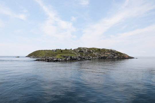 View Of A Distant Island In The Ocean