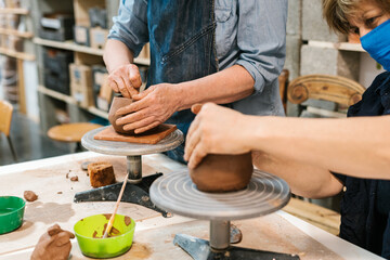 Anonymous hands of women potters