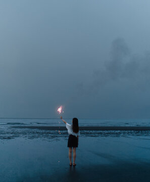 Girl With Small Spark On The Hand