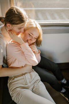 guy and girl cuddle on the train