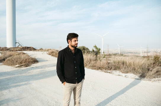 A man on the background of windmills outdoor.