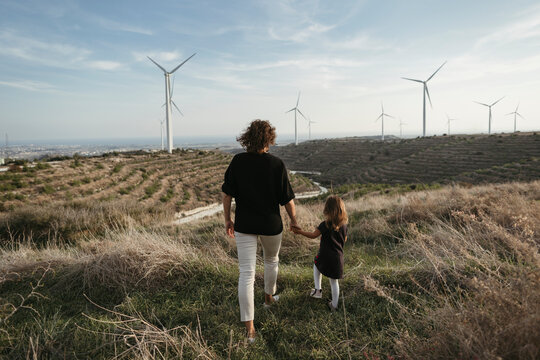 A mother with a little daughter on a walk.