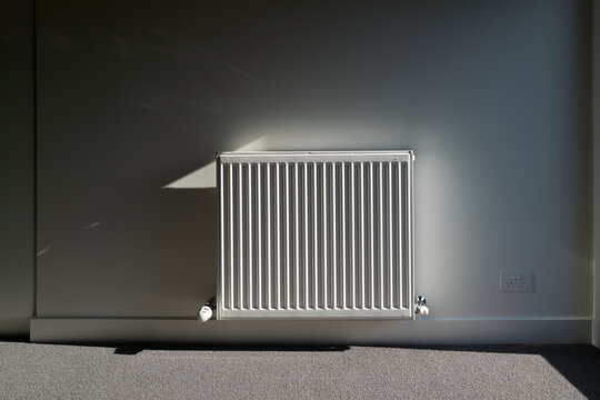 Empty room of new home with radiator heater
