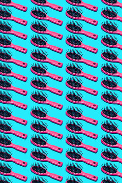 pink hairbrushes on a blue background