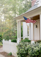 Southern front porch with American flag