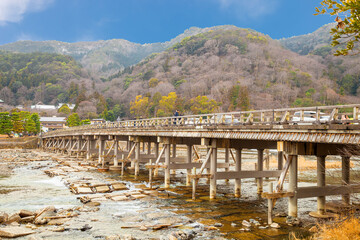 Fototapeta na wymiar autumn background Togetsukyo bridge Hozu river in Arashiyama district Kyoto, Japan., The famous Togetsukyo Bridge in Arashiyama Kyoto, Japan.