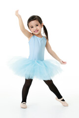 Fototapeta premium Portrait isolated studio shot of small beautiful Asian kindergarten pigtails ballerina dancer girl in blue tutu ballet dress black legging standing posing in cute gestures