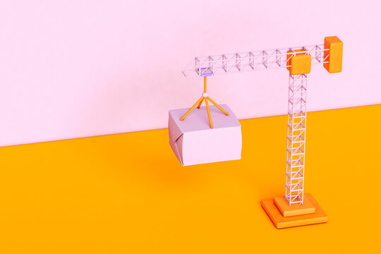 Tower crane moving a box