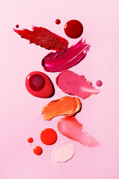 Red and peach lipstick cosmetics swatches