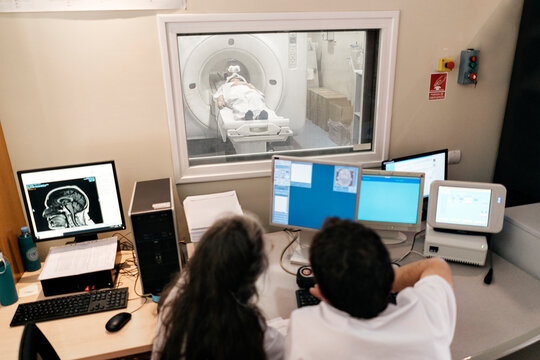 Doctors Checking X-Ray Machine