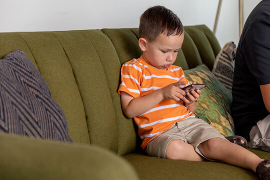 Young Boy Uses Smart Phone