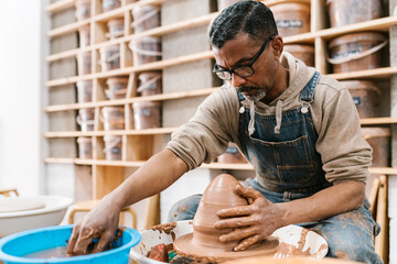 Potter working on the potter's wheel