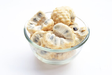 Custard apple in glass bowl on white background.