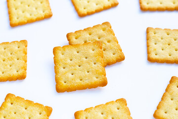 Dry cracker cookies on white background.