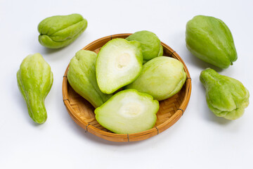 Fresh chayote fruit on white background.