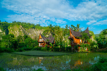 Villa with Minangkabau house or Rumah Gadang style in a beautiful landscape view of Ngarai Sianok...