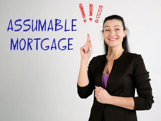 Business concept meaning ASSUMABLE MORTGAGE exclamation marks with phrase on the wall