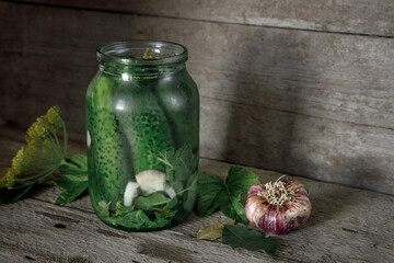 Pickled canned cucumbers with spices in glass jar. Home preparations