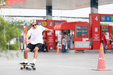 Fototapeta na wymiar young man skater riding on skateboard