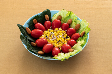 Lettuce and tomato salad in a bowl heroe shot